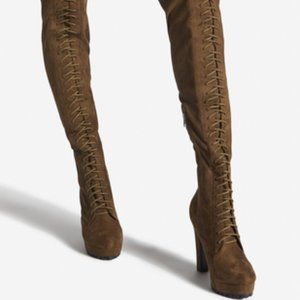 OTK platform boot with lace-up styling and zip closure.